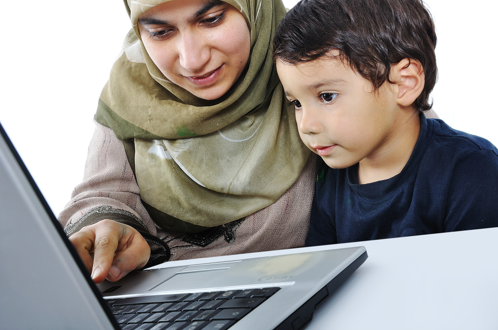 Muslim-woman-and-her-son-on-laptop.jpg